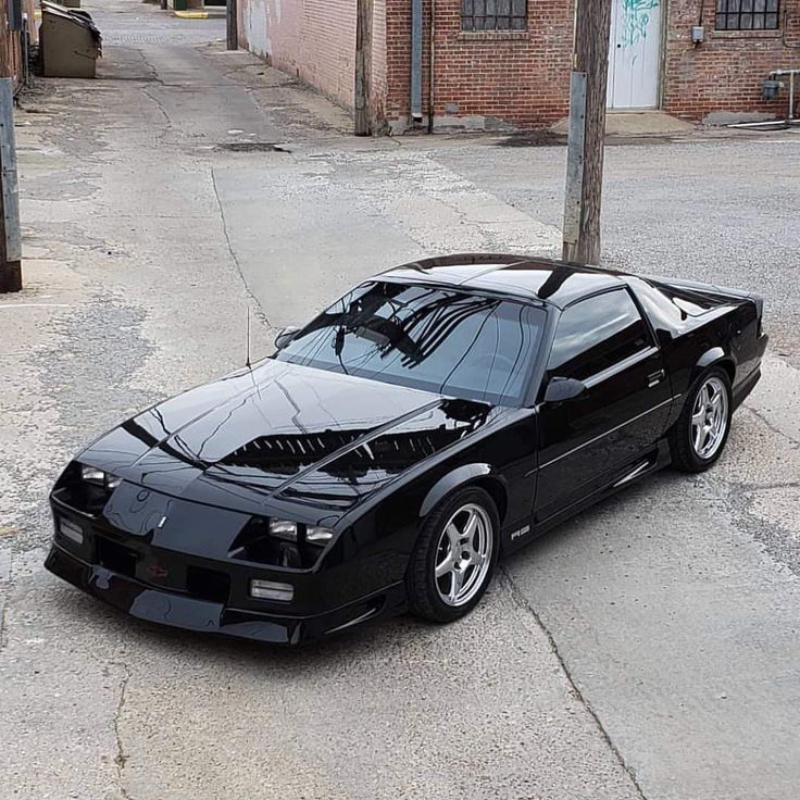 a black sports car parked on the street