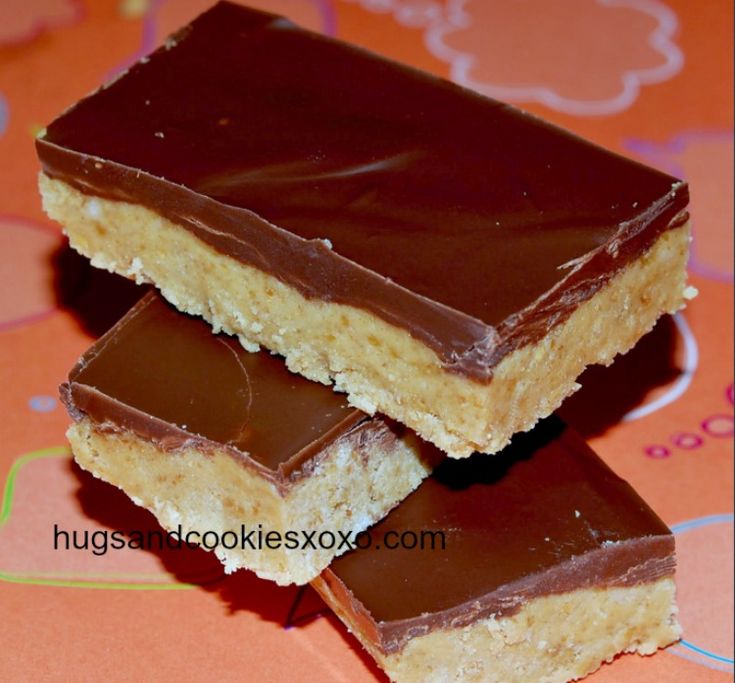 two pieces of peanut butter bars stacked on top of each other