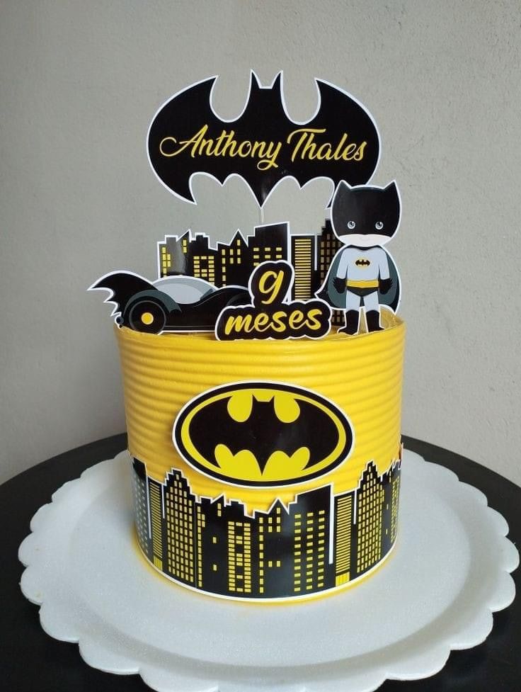 a batman themed birthday cake on a plate