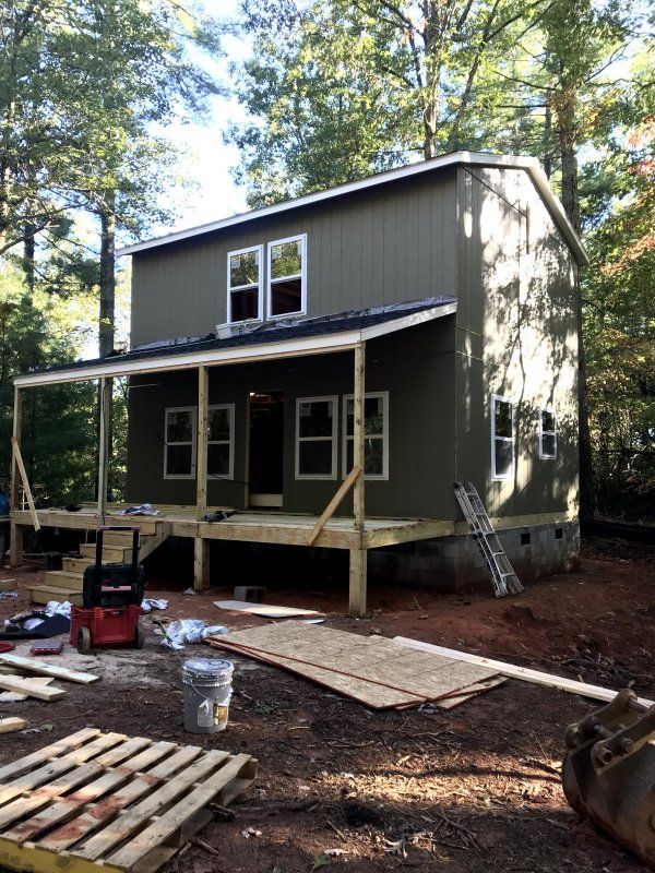 a small house is being built in the woods