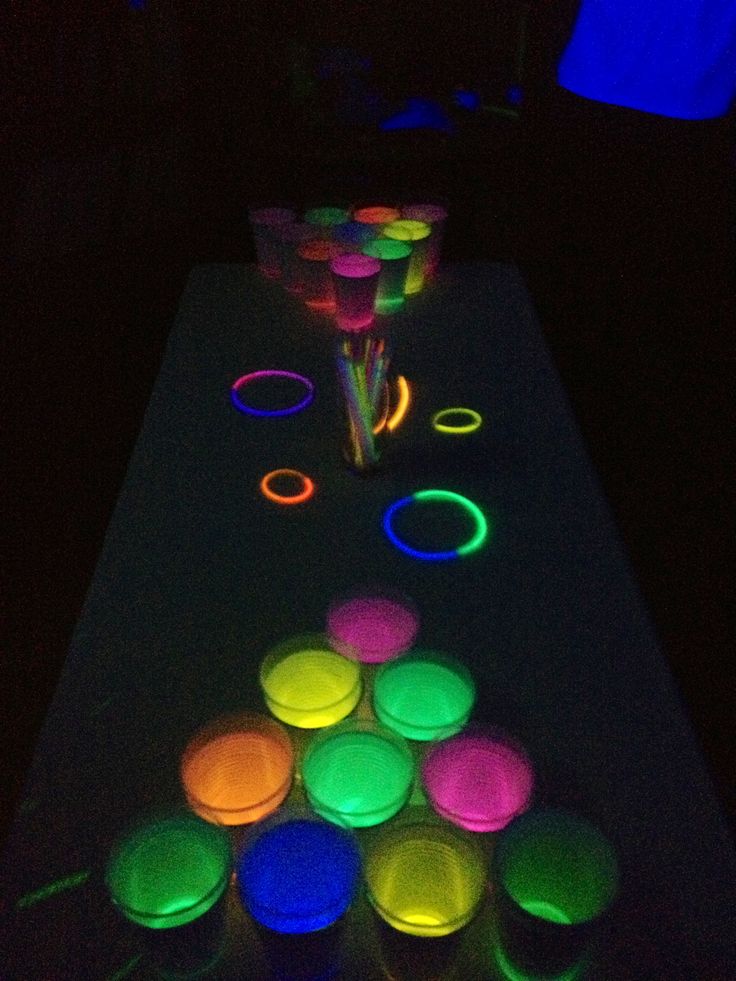 glow in the dark table with cups on it