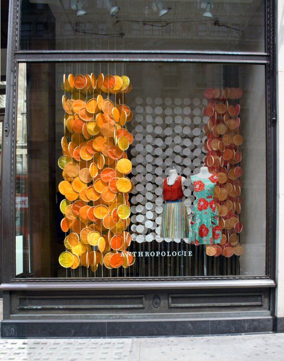 an image of a window display with oranges in it