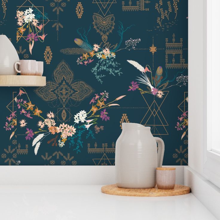 the wallpaper in this room is painted with flowers and leaves, while the vases are