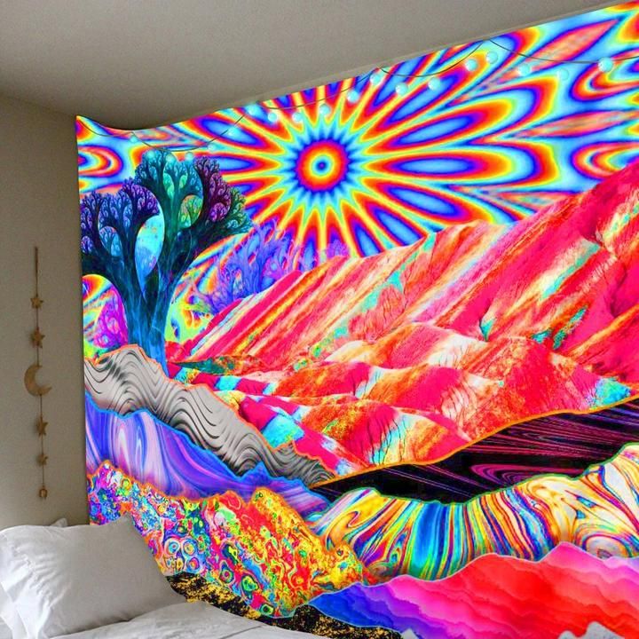 a bed with a colorful wall hanging over it