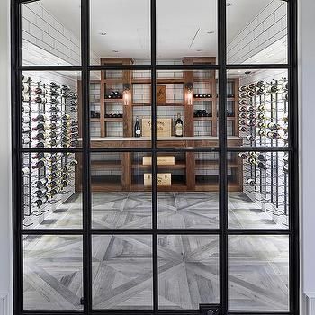 an open glass door leading to a wine cellar