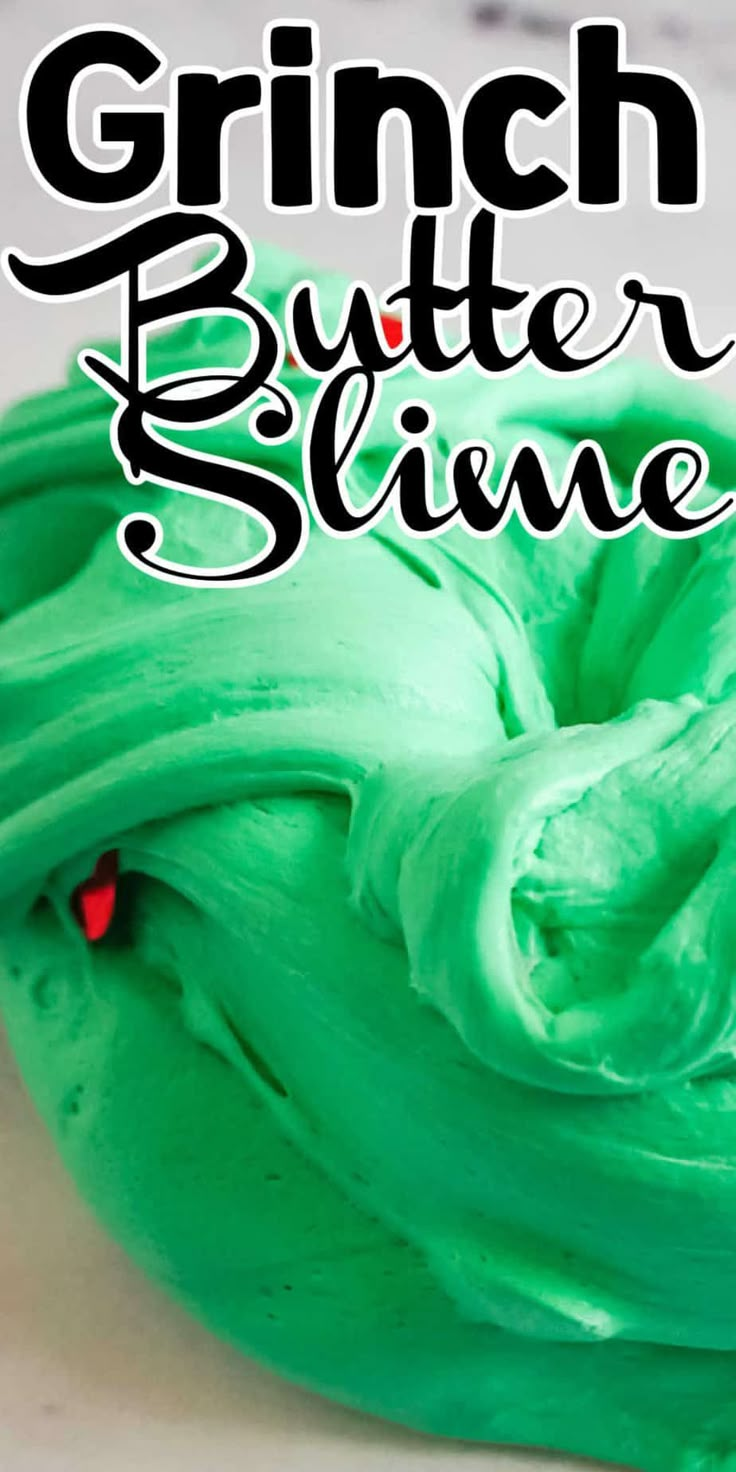 a close up of a cake with green frosting on it and the words, grin butter slime