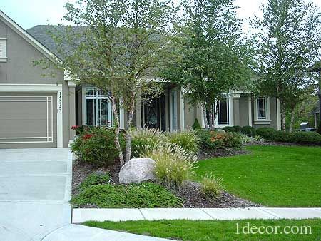 a house with landscaping in front of it