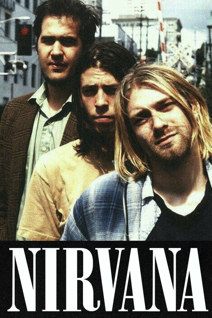 the nirvana band is standing in front of a traffic light and street sign that says nirvana