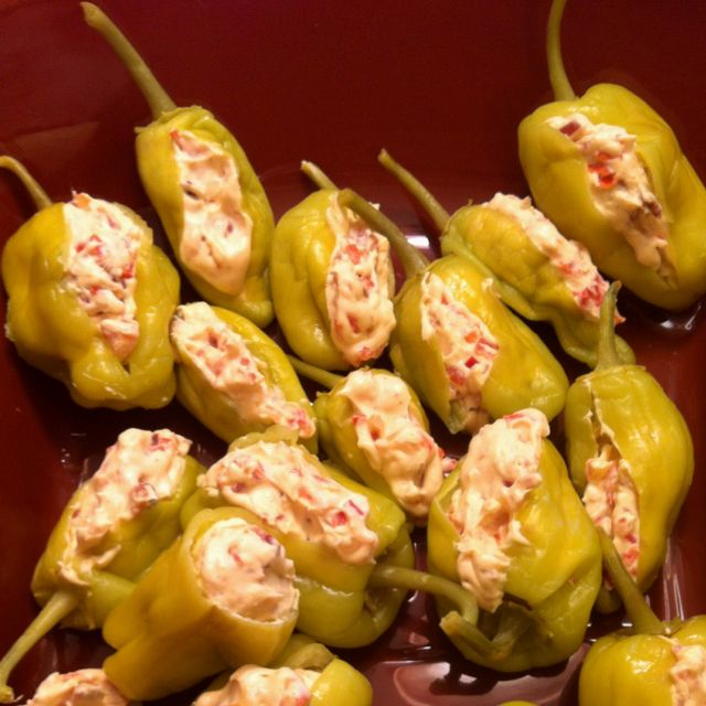 stuffed pepperoni ingredients in a red bowl with text describing how to make stuffed peppers