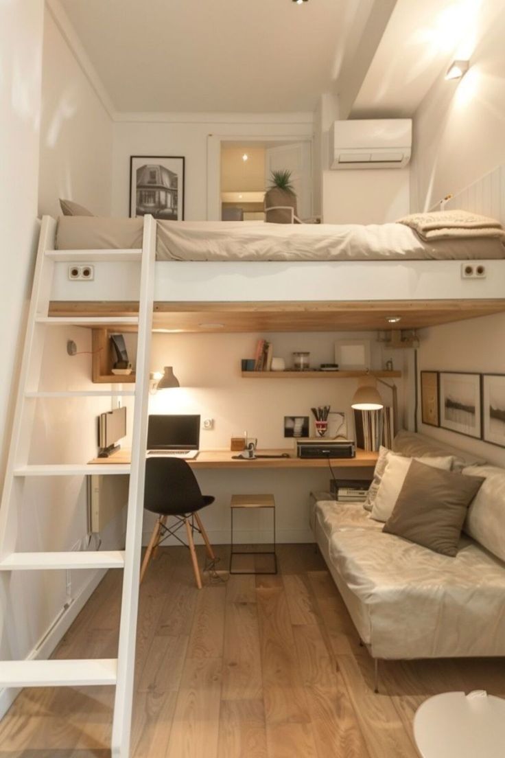 a loft bed with a desk underneath and stairs leading up to the upper level,