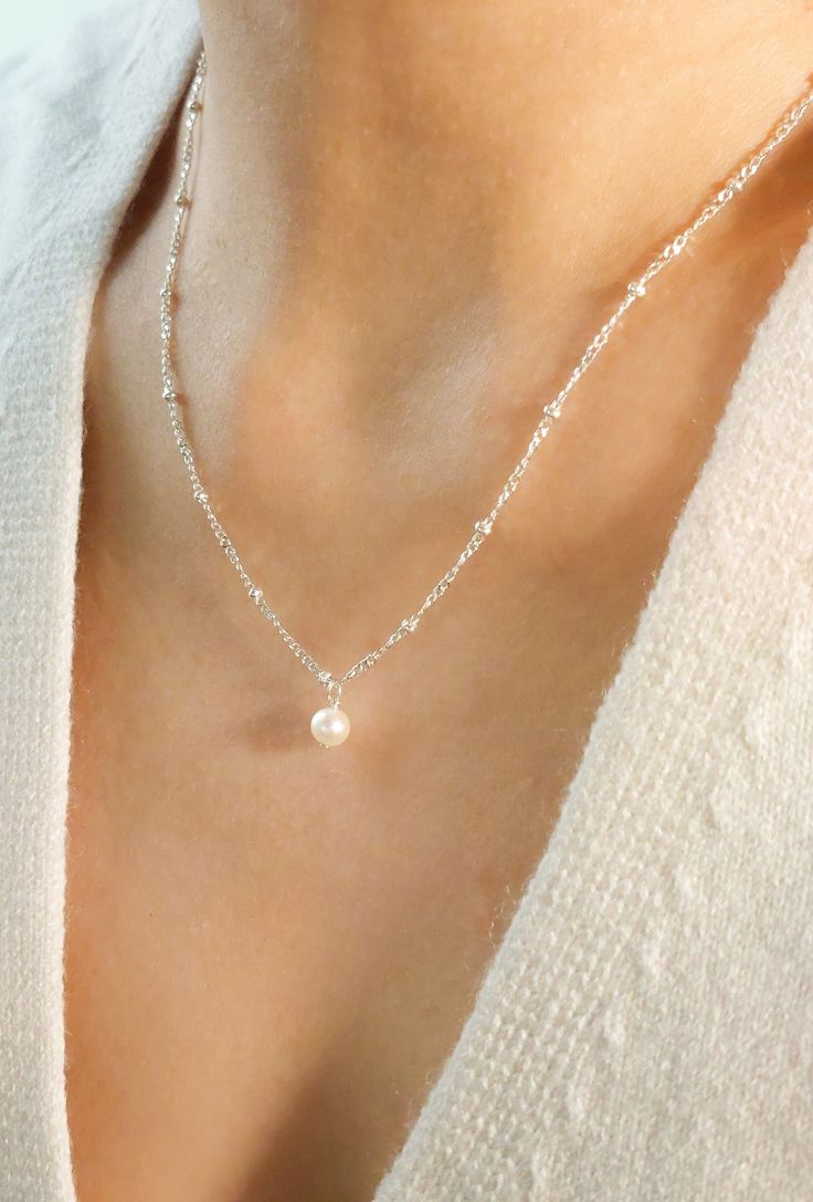 Minimalist Single Pearl Necklace Dainty Silver Pearl Necklace Real Freshwater Pearl Drop Necklace Gift for Bridesmaid Layered Necklace Pearl * Pair a dainty lustrous pearl with a delicate chain of your choice to create your own style! A variety of sterling silver and gold filled chains are available for choice.  * Pearl is the birthstone for the month of June and is also a traditional wedding gift. This beautiful pearl necklace will definitely be perfect as birthday gifts, wedding gifts, bridesm Sterling Silver Pearl Necklace, Dainty Silver Pearl Necklace, Cheap Silver Minimalist Pearl Necklace, Silver Dainty Necklace, Dainty Silver Choker, Dainty Sterling Silver Pearl Drop Necklaces, Dainty Silver Pearl Wedding Necklace, Pearl Necklace Silver, Silver And Pearl Jewelry