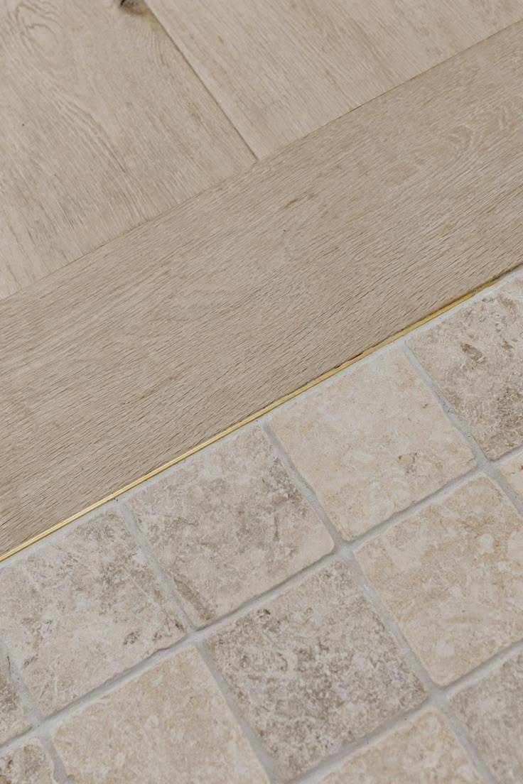 a white toilet sitting on top of a tiled floor