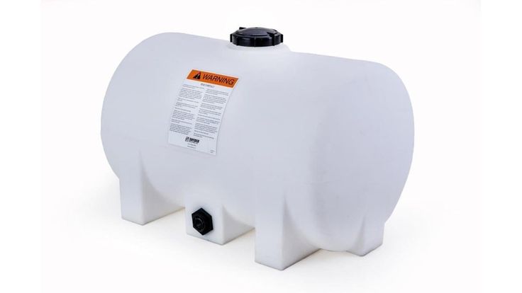 a large white tank with an orange label on it