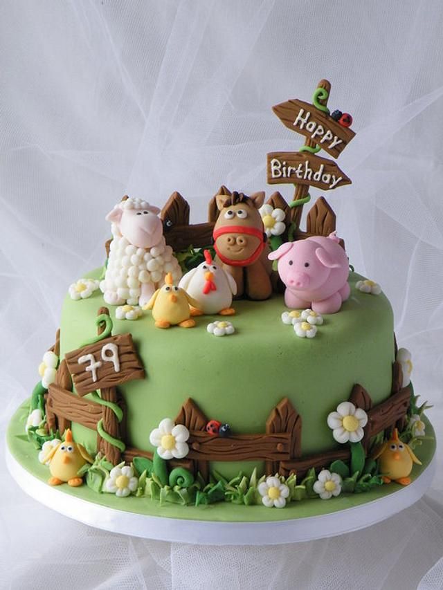 a birthday cake with farm animals on it