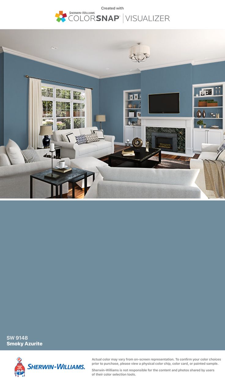 a living room with gray walls and white furniture