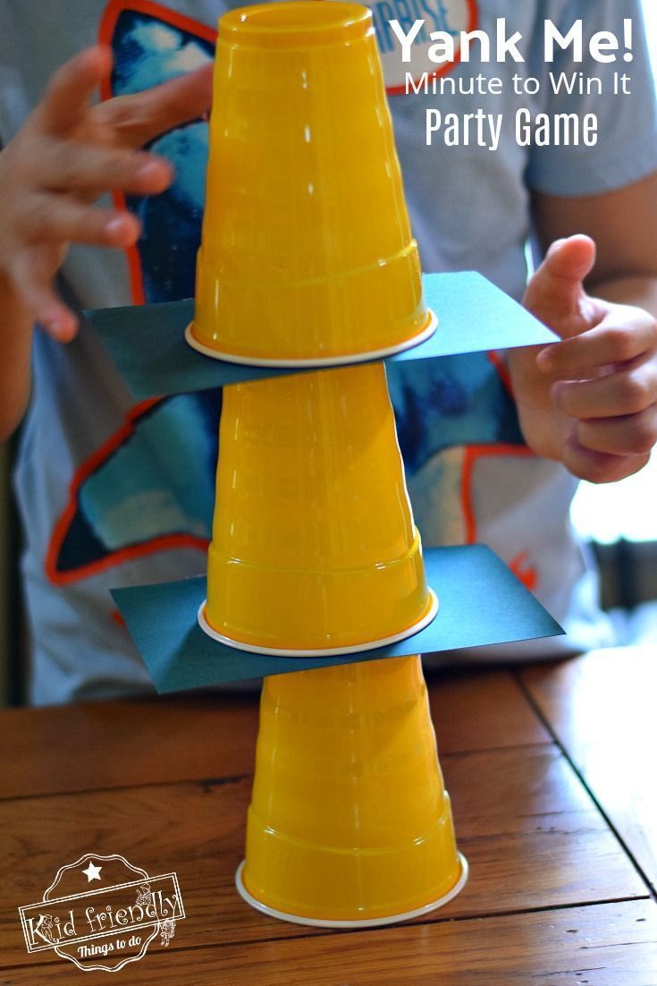 a young boy is playing with a yellow plastic cone game that he made for his birthday party