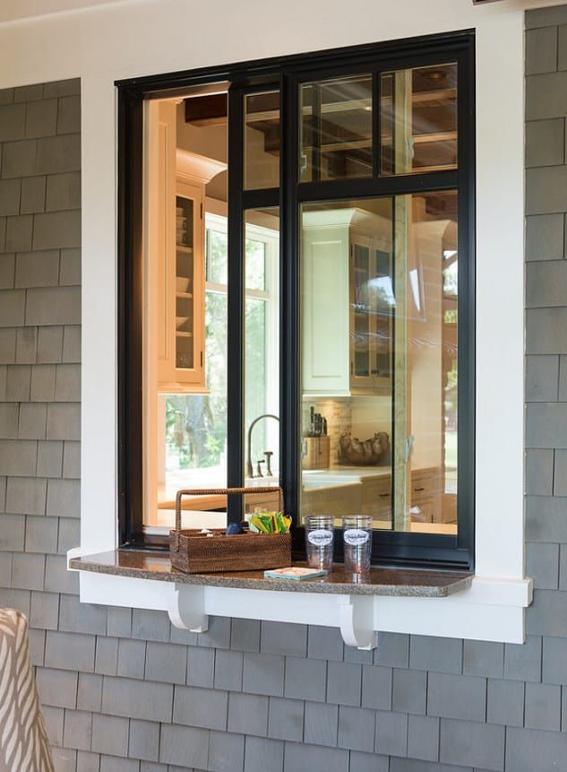 an open window on the side of a house