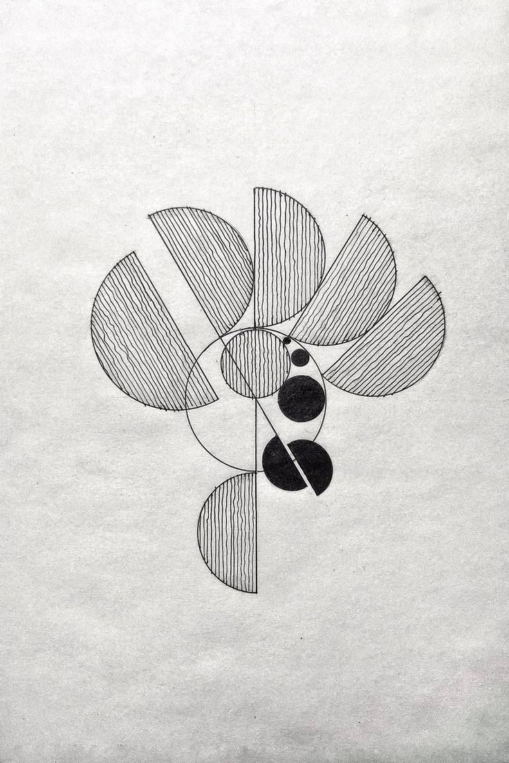 a black and white drawing of a flower on a piece of paper with circles around it