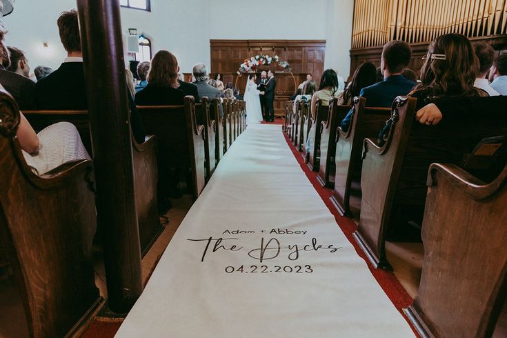 a wedding aisle with the bride and groom's names on it