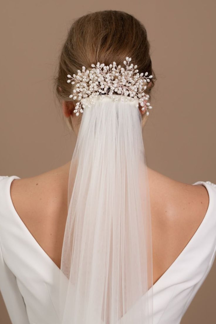 For a bridal hair comb that doesn't feel too traditional or too trendy, look for a classic style with a modern twist. Layers of small ivory seed pearl sprigs have been hand-wired onto a silver veil comb to add prettiness to your bridal veil. #weddingideas #bridalideas #weddinghairstyle #bridalhairstyle Hair Comb With Veil, Silver Veil, Bridal Hair Jewellery, Veil Pearl, Veil Comb, Modern Wedding Theme, Pearl Wedding Hair, Beautiful Wedding Hair, Comb Veil