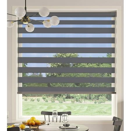 a dining room table and chairs in front of a window with blinds on the windowsill