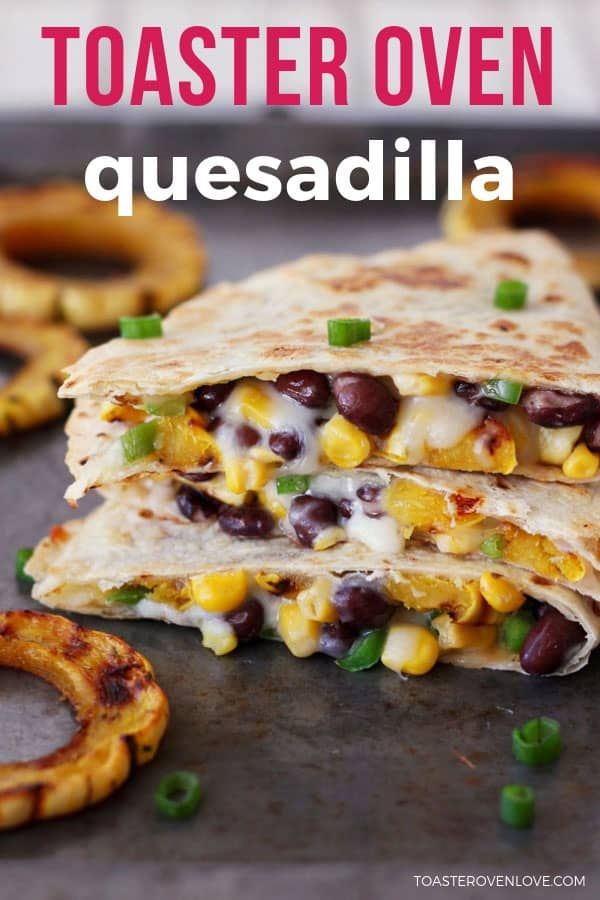 a close up of a quesadilla with black beans and corn on it