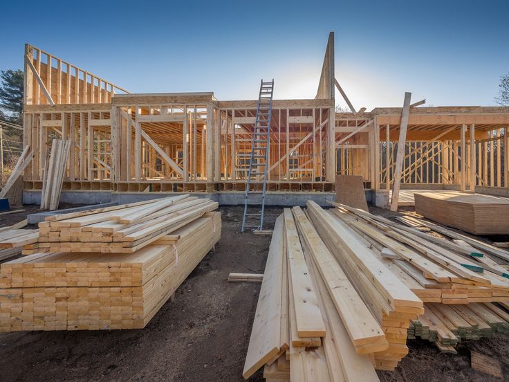 a house under construction with wooden framing and scaffolding