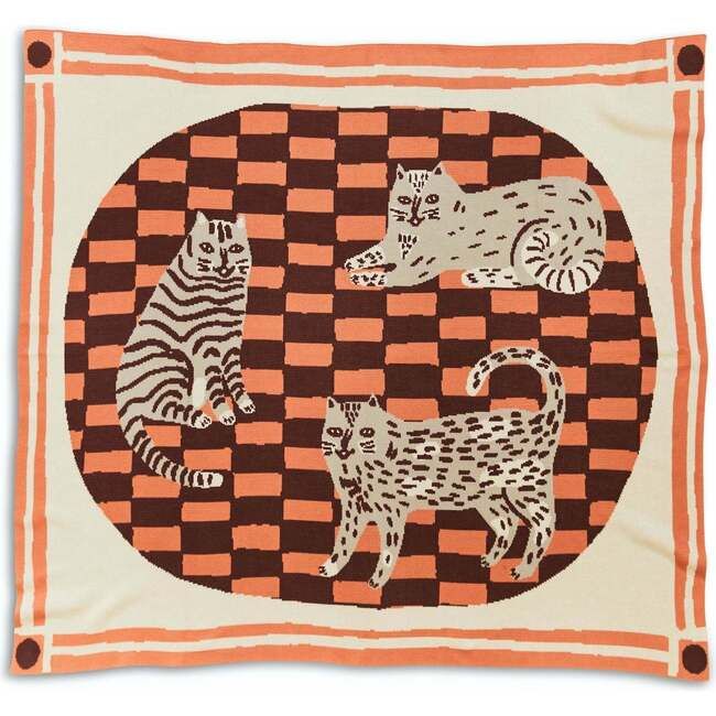 an orange and white wall hanging with three cats in a circle on top of it