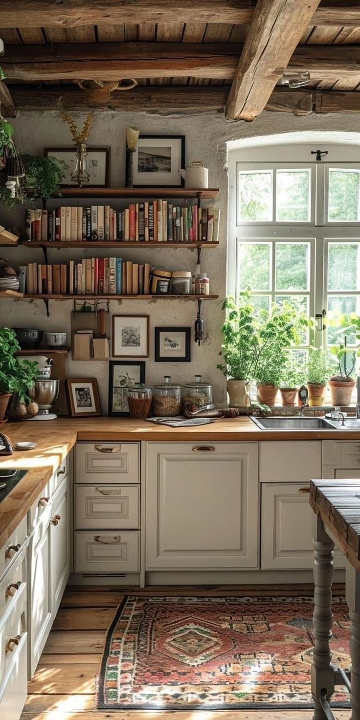 a kitchen filled with lots of counter top space next to a sink and window covered in books