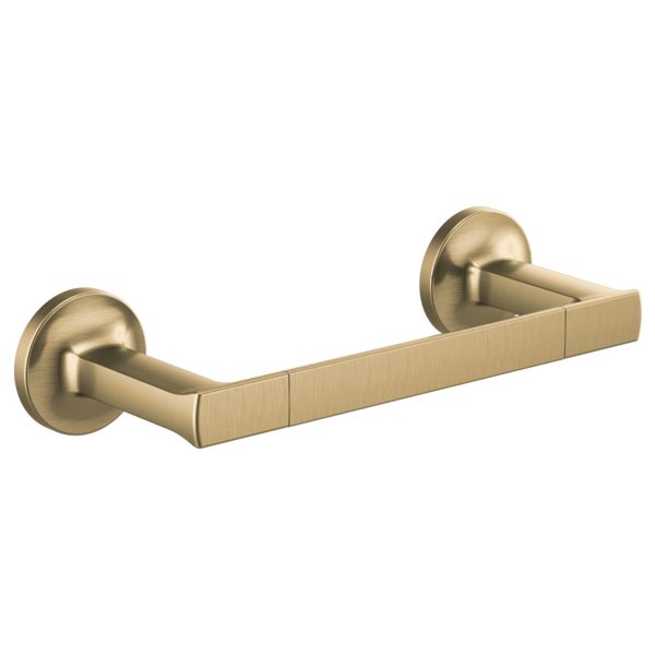 an antique brass toilet paper holder on a white background