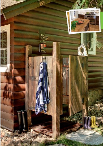 the outside of a cabin with a towel and boots hanging on it's door