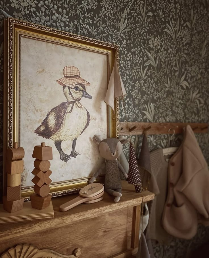 there is a painting on the wall with a duck in it's hat and other items