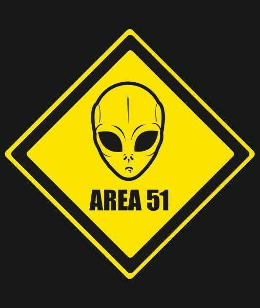 an alien crossing sign with the words area 51 in black and yellow, against a dark background