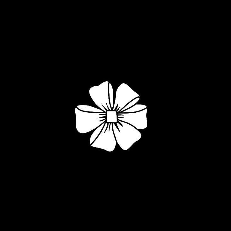 a white flower on a black background with the word's logo in the center