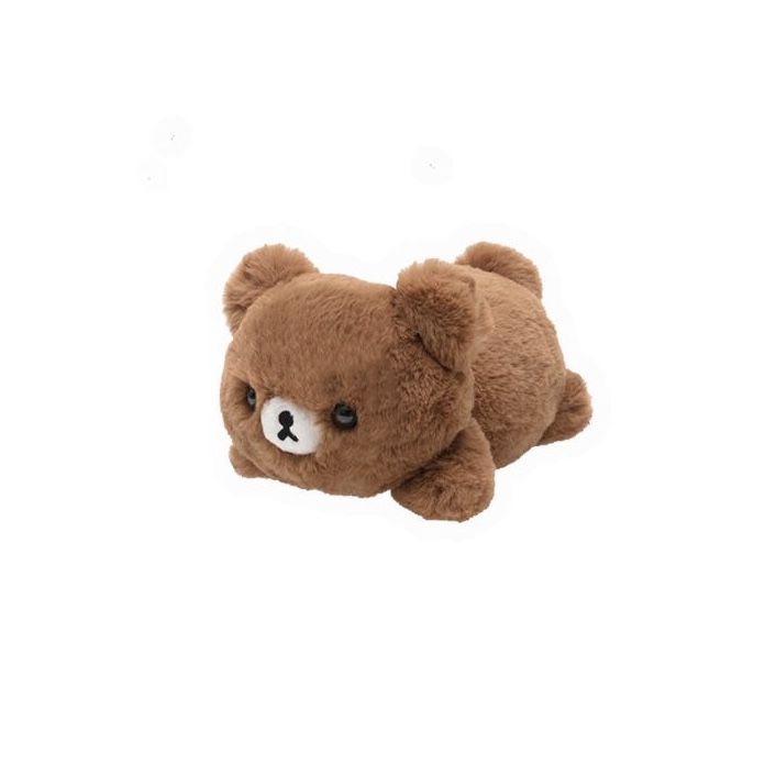 a brown teddy bear laying on its side