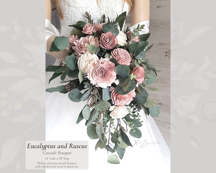 a woman in a wedding dress holding a bouquet of pink and white flowers with greenery