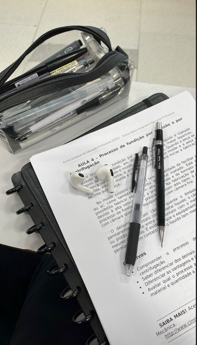 a pen and some papers on a table