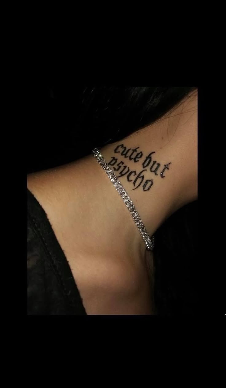 the back of a woman's neck with an inscription on it that reads, but not