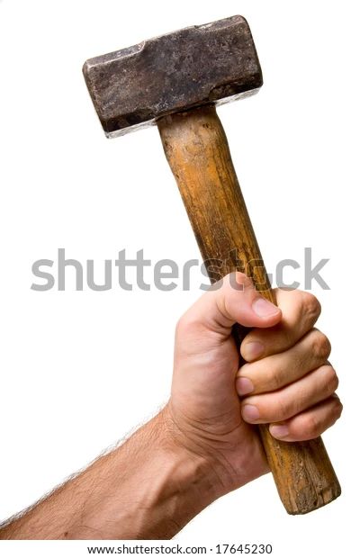 a man's hand holding an old wooden hammer over white background - stock photo