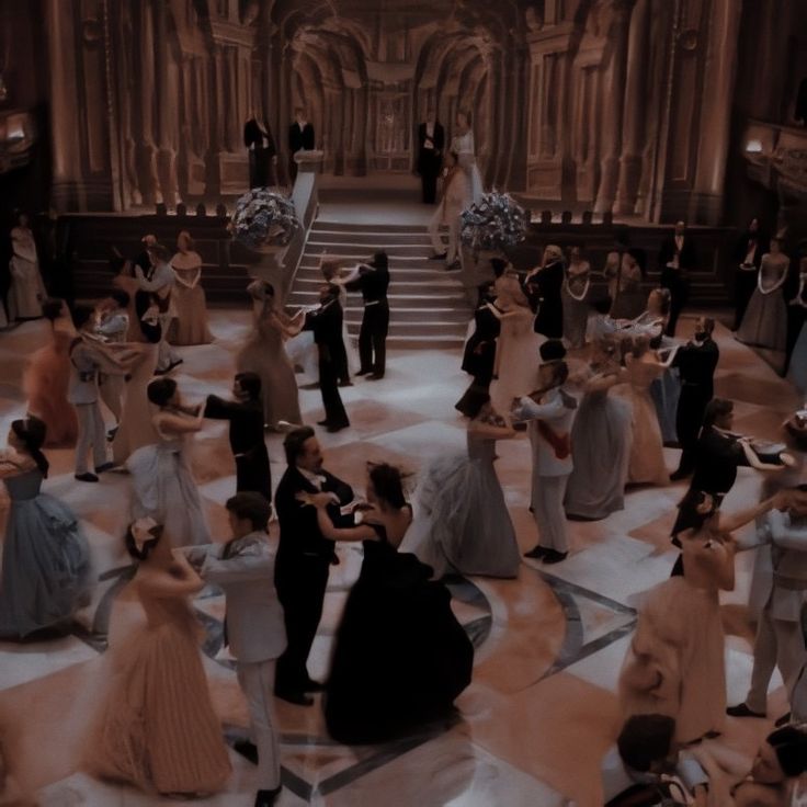 a large group of people in formal dress dancing