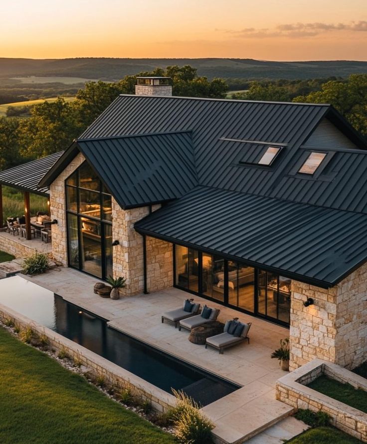 an aerial view of a house with a swimming pool