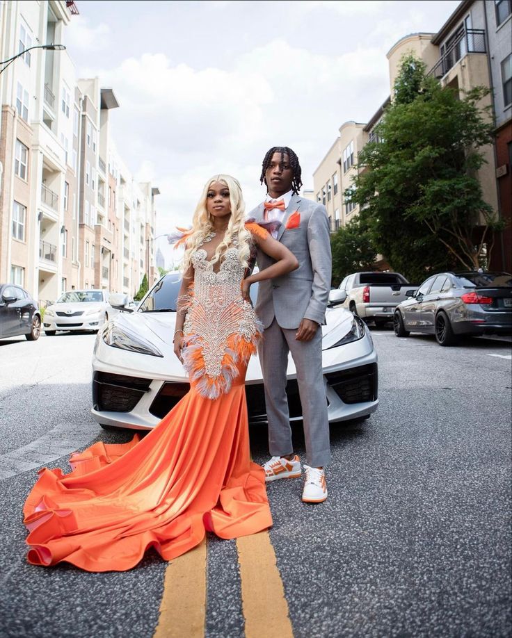 Orange And Silver Prom Couple, Orange And Gray Prom Couple, Orange And Silver Prom Suit, Orange And White Prom Couples, Prom Dress Inspiration Orange, Prom 2024 Black People, Orange Prom Black Couple, Orange And Tan Prom, Orange And Grey Prom Couple