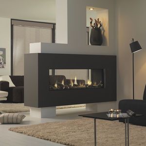 a modern living room with a fireplace in the center