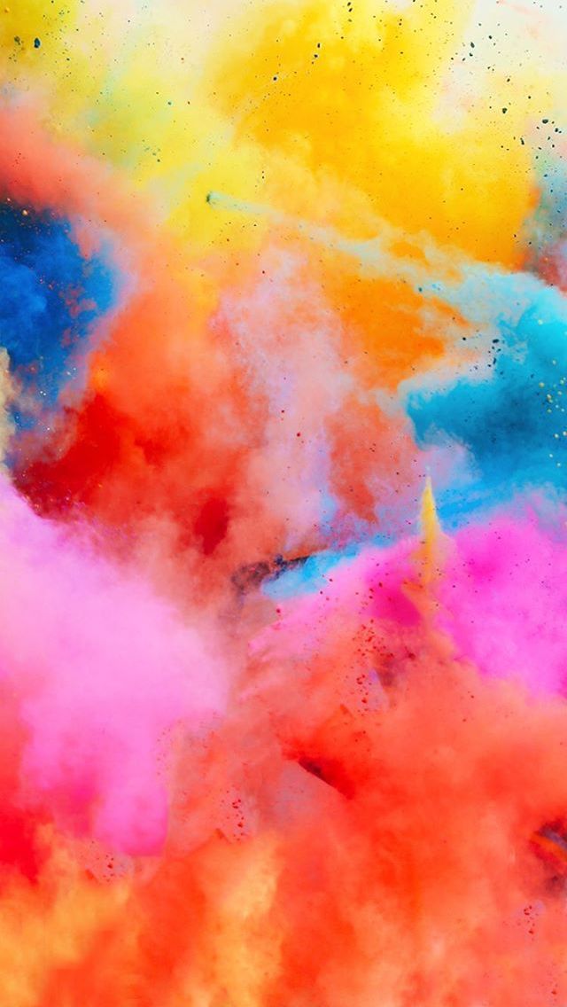 colorful powder is mixed with each other in the air to make it look like they are on fire