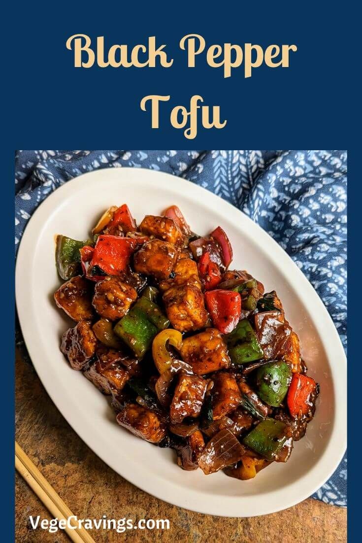 black pepper tofu on a white plate with chopsticks next to it and the title overlay reads, black pepper tofu