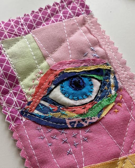 a close up of a piece of cloth with an eye on it