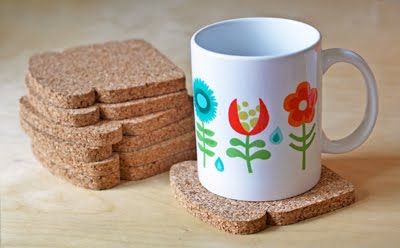 there is a coffee cup and some cookies on the table