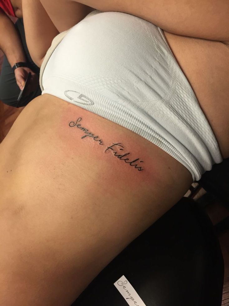 a woman with a tattoo on her stomach that says, hope fields written in cursive writing