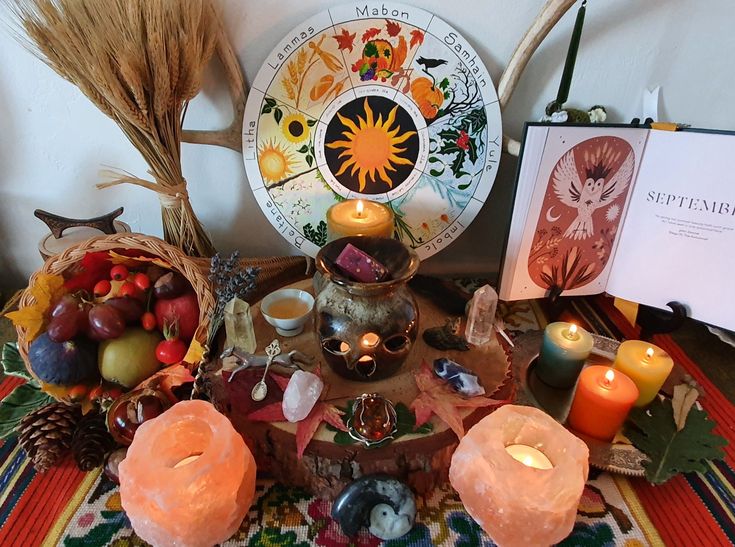 a table topped with candles and other items