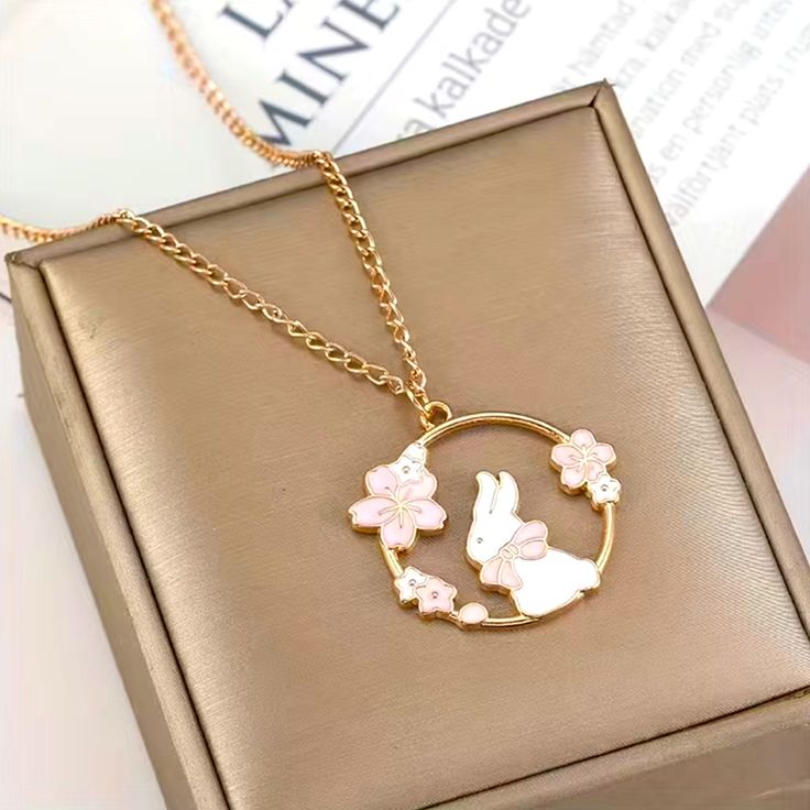 Bunny Rabbit Pendant Necklace Fashion Jewelry Gold Colored Chain White Bunny With Pink Bow And Flowers Lightweight Adorable And Cute Makes A Sweet Gift Jewelry Accessories Necklaces, Cartoon Jewelry, Necklaces Pink, Cherry Blossom Necklace, Bunny Cat, Sakura Blossoms, Bunny Cartoon, Accessories Necklaces, Rabbit Pendant